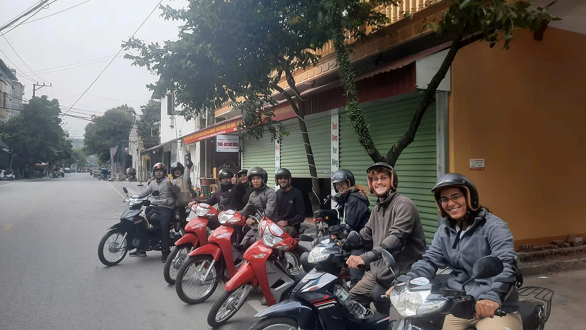 Riders rolling out of Ha Giang city in the morning