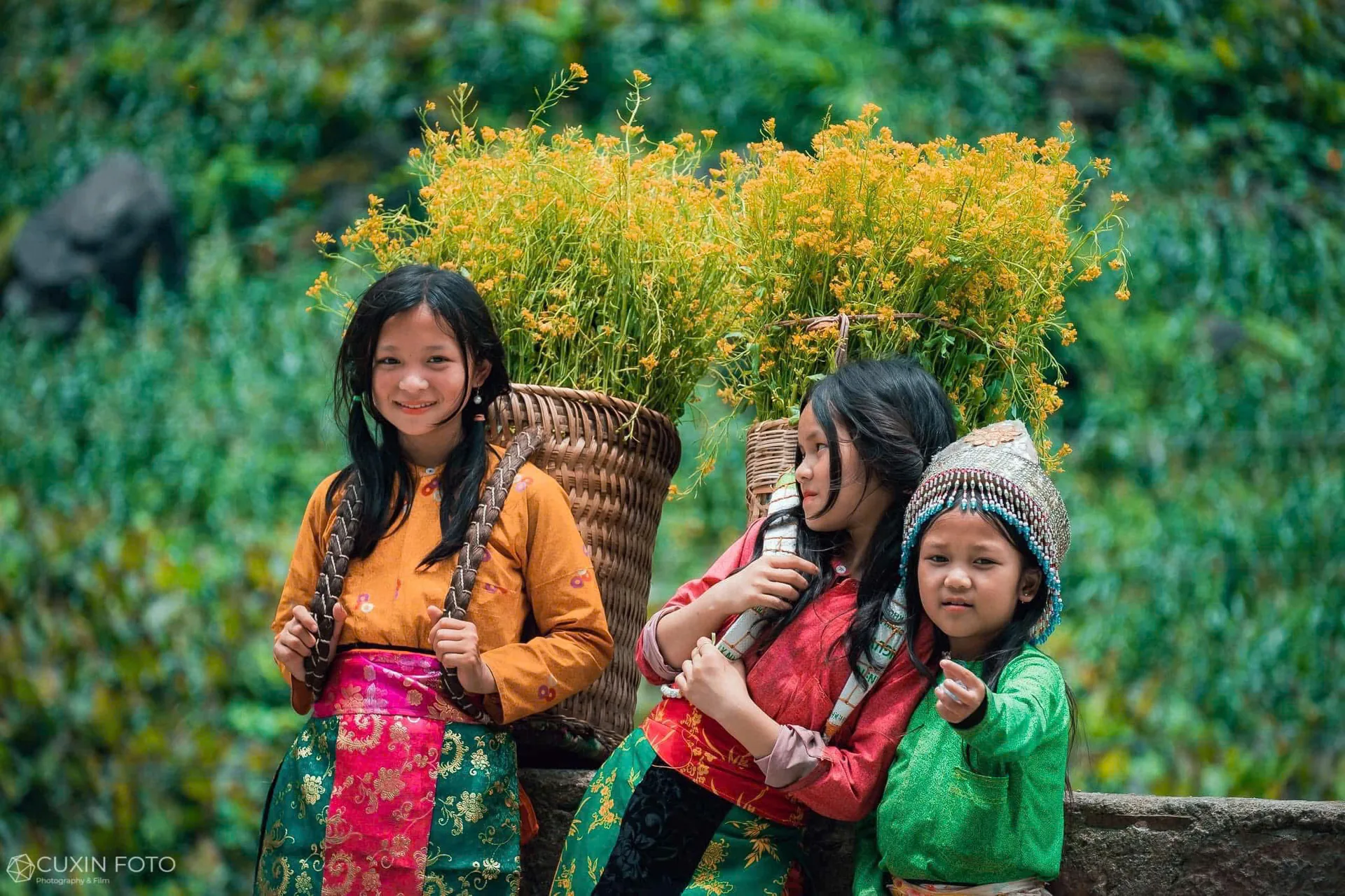 H'mong children in traditional dress in a village on the Loop