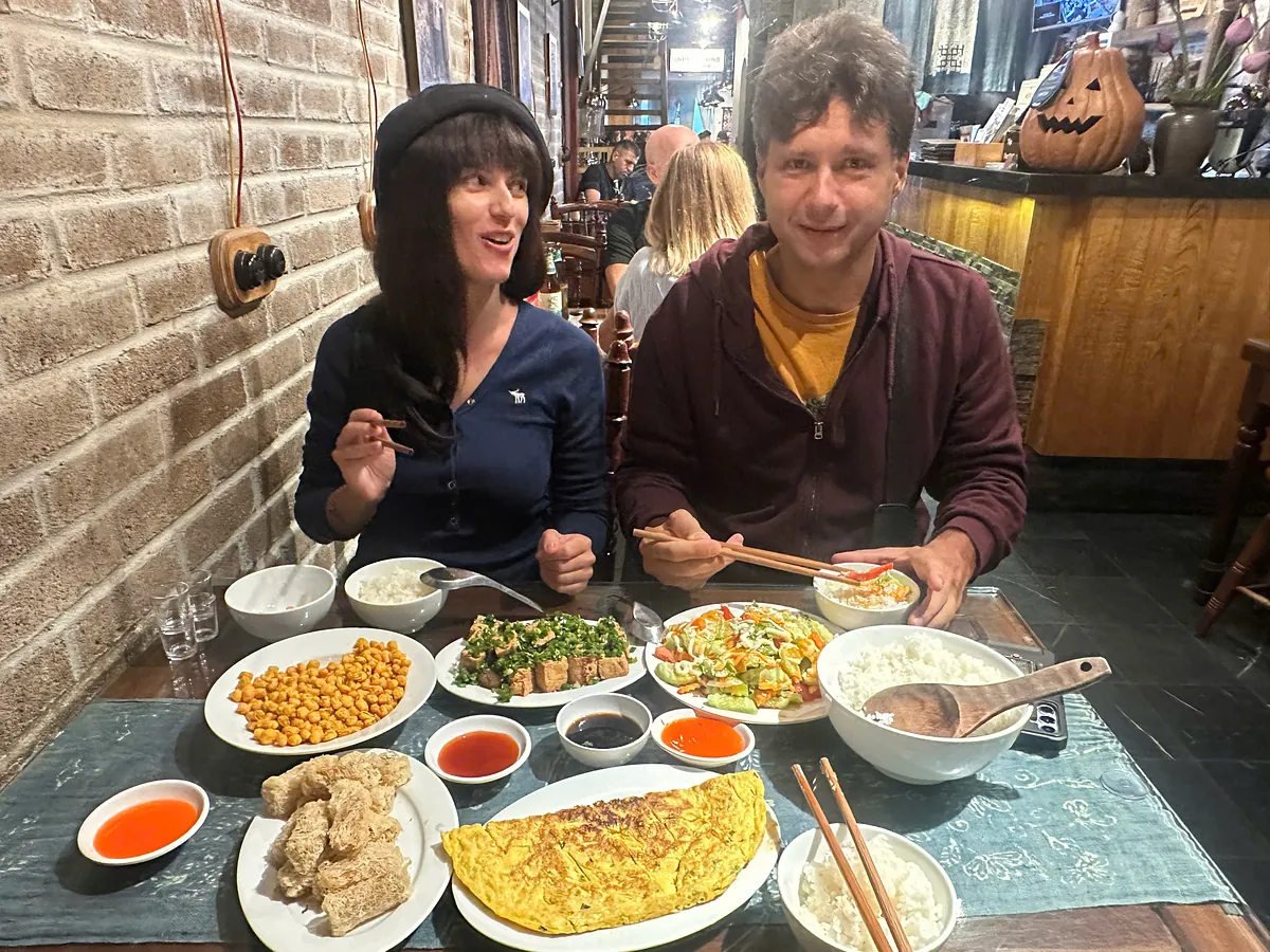 Lunch for two in a local restaurant on the Loop: omelette, greens, tofu and rice