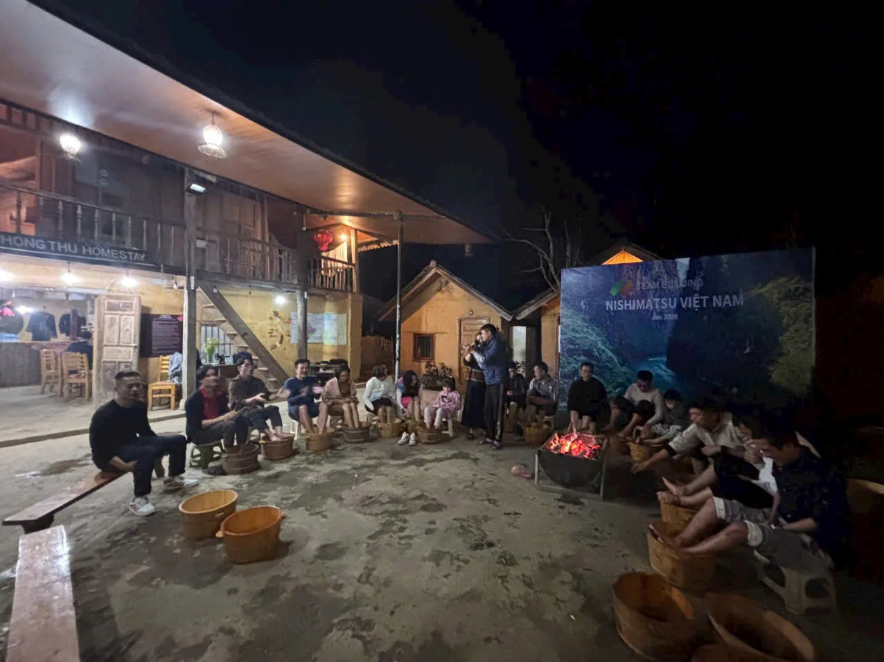 Evening herbal foot bath by the fire at the homestay